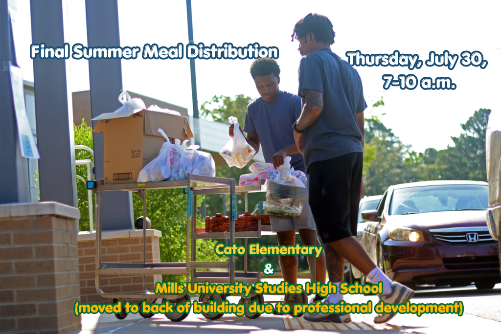 Two people loading cars with groceries from a cart.