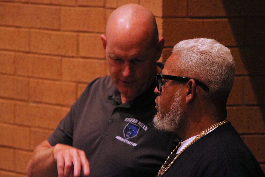 two principals speaking with one another