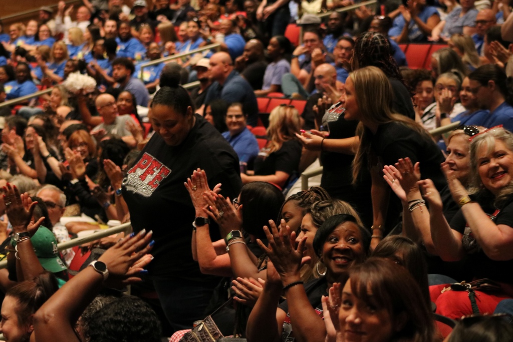 people clapping for standing new teachers
