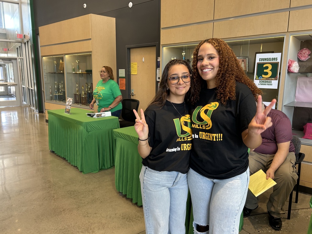 Student helpers posing for a photo in matching shirts
