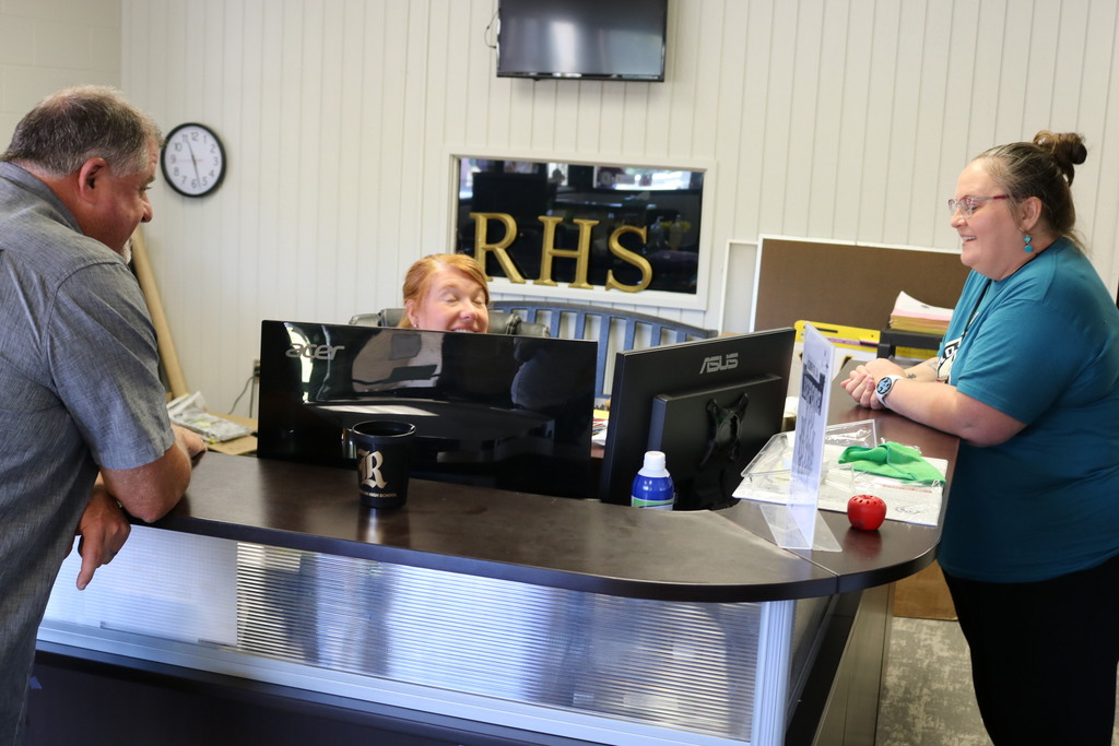 Two people in an RHS school office
