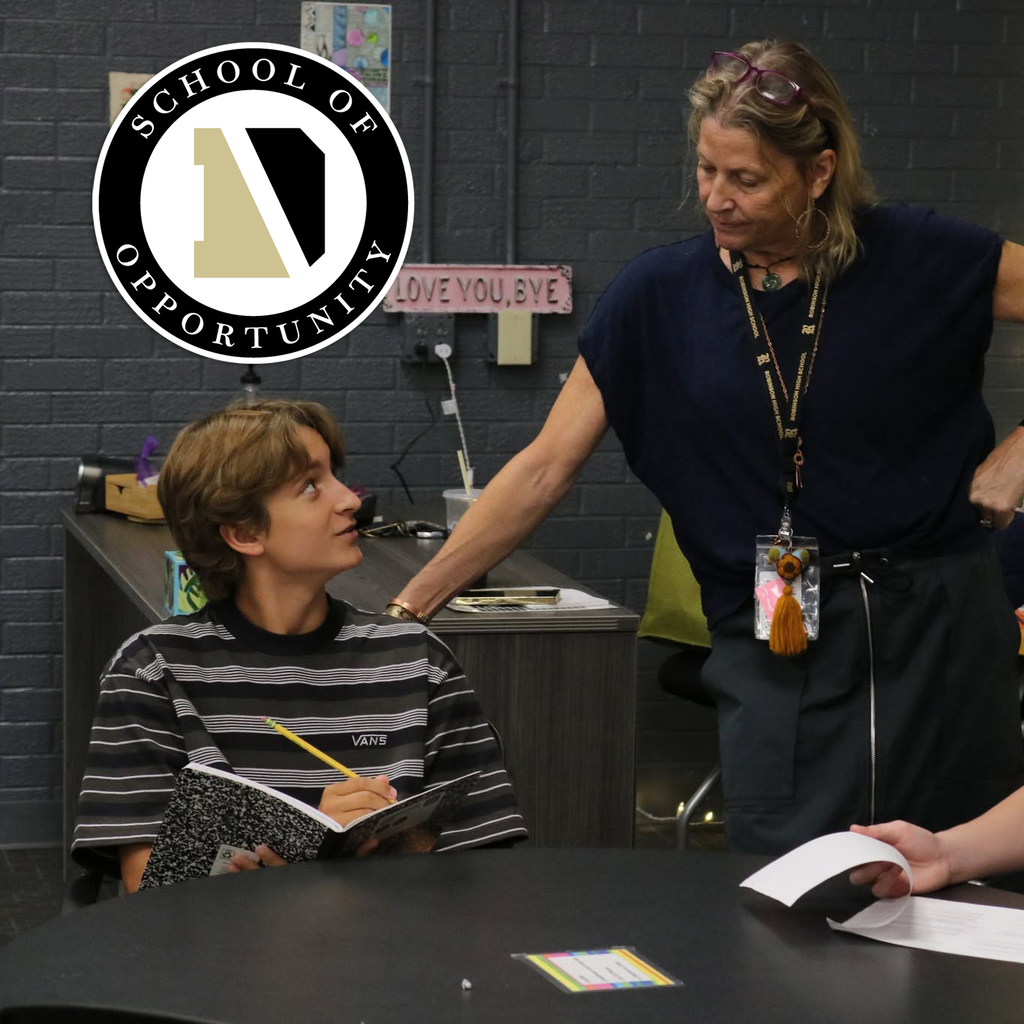 A student looking up at a teacher