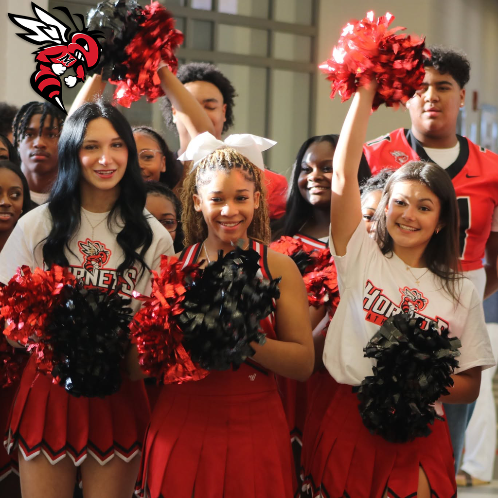 cheerleaders in front of a student crowd