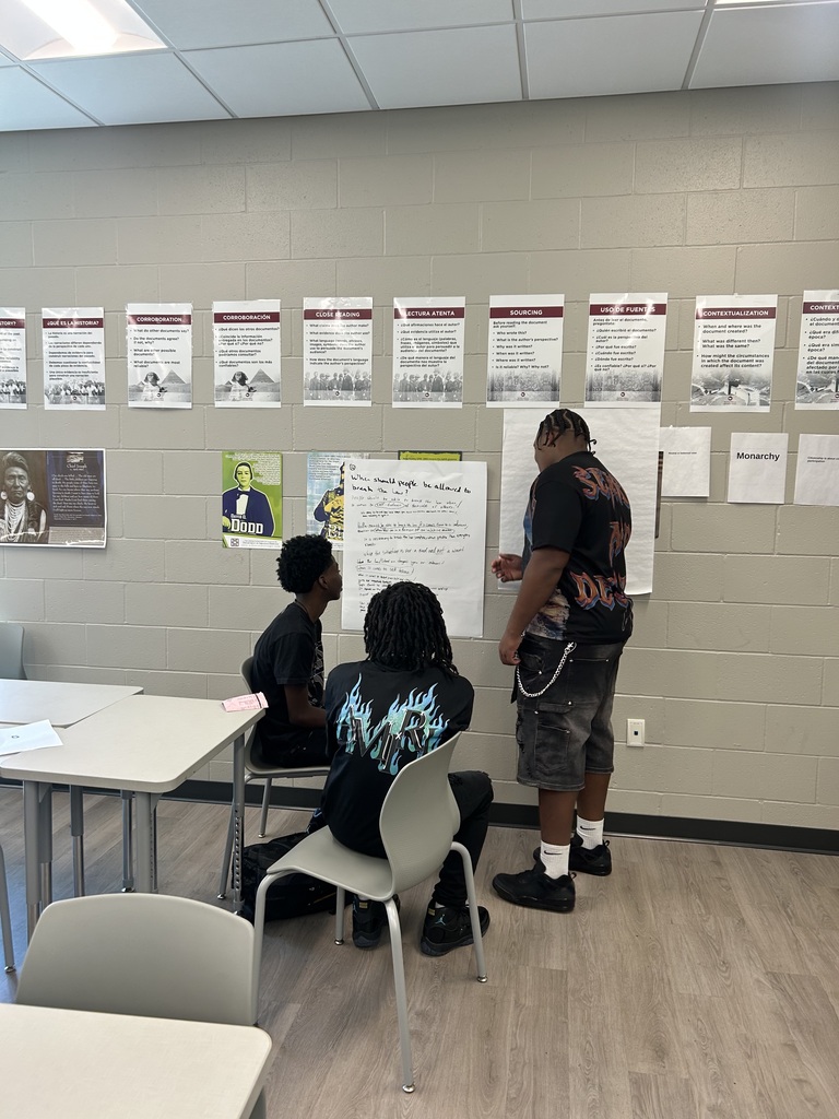 Students working in a group on chart paper