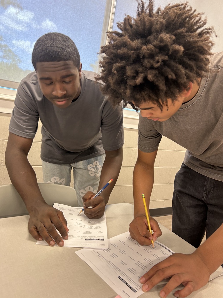 Students writing on their papers