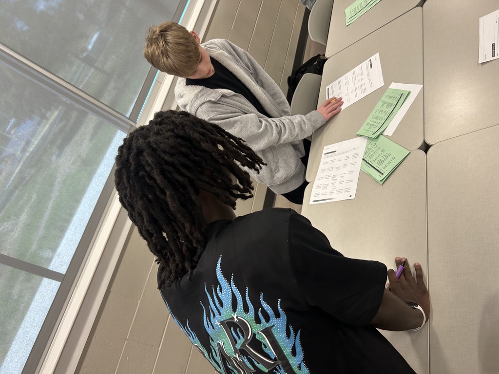 Students writing on paper