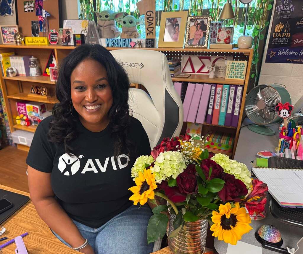 A person wearing an AVID shirt.