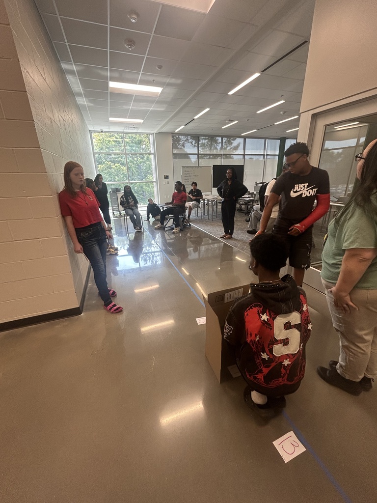 Students collaborating on creating human box plots