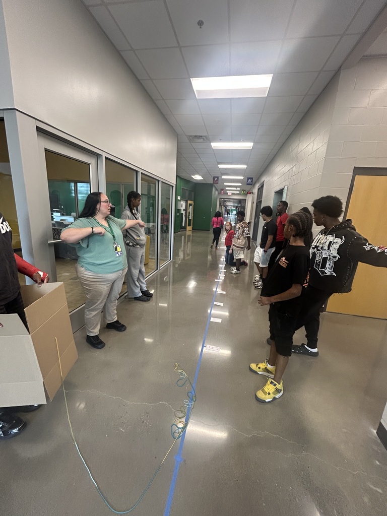 Students creating a human box plot on a number line