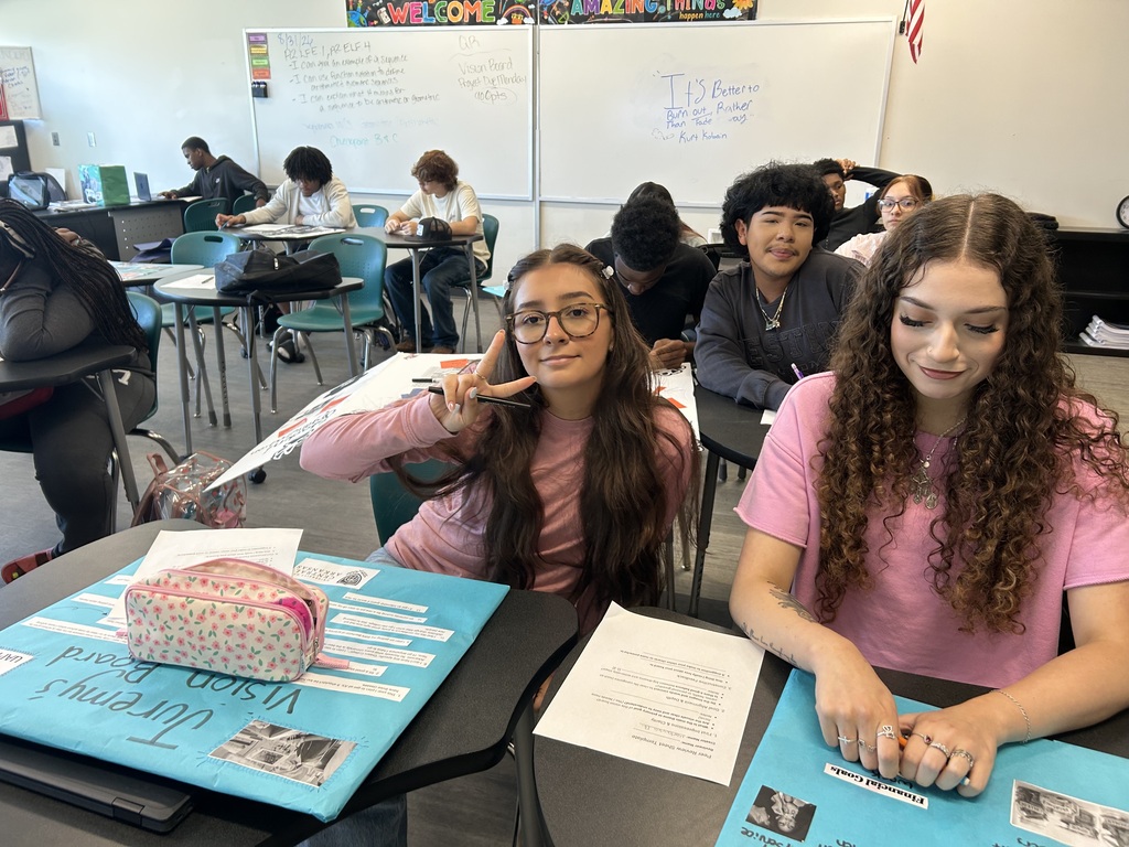 Two students working on their poster project