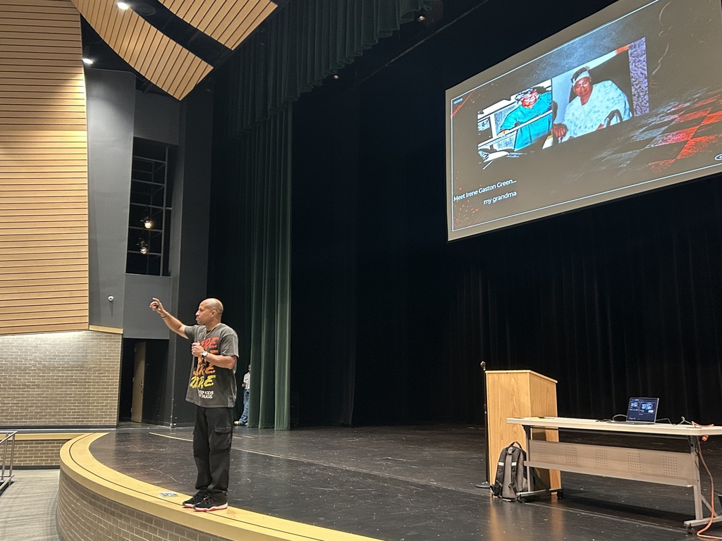 Guest Speaker on stage in auditorium