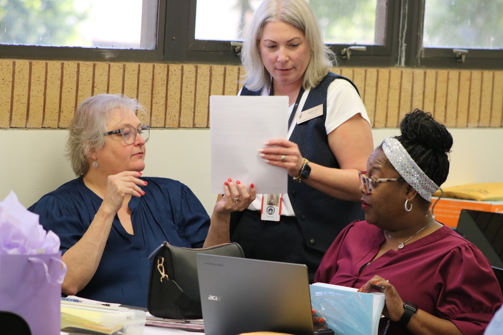 three principals collaborating