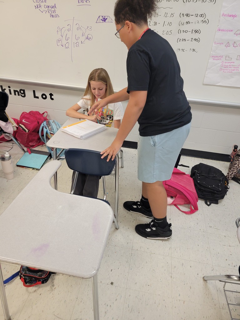 football players helping with student work3