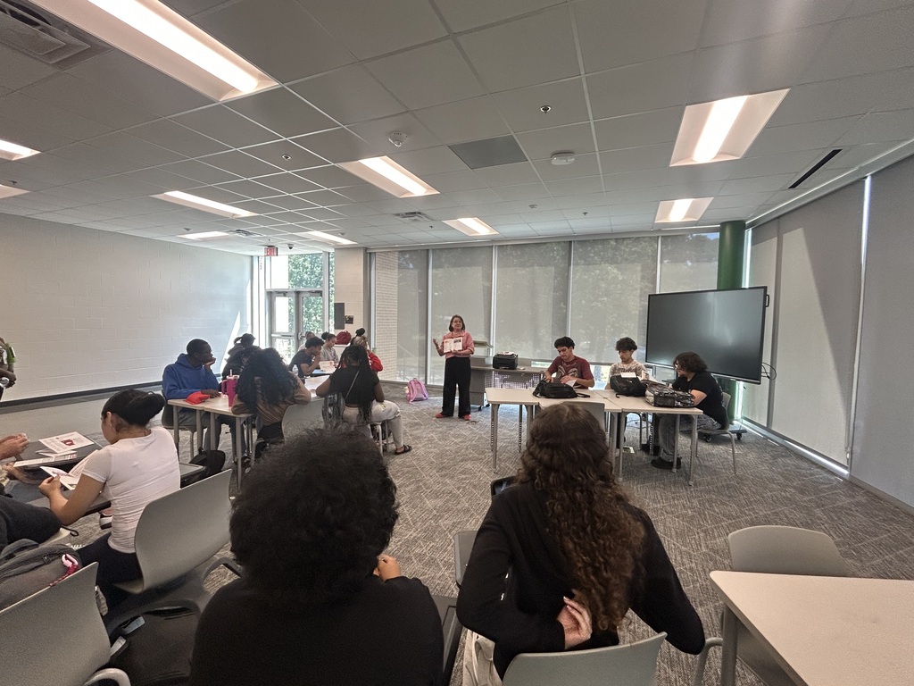 Students in classroom listening to guest speaker