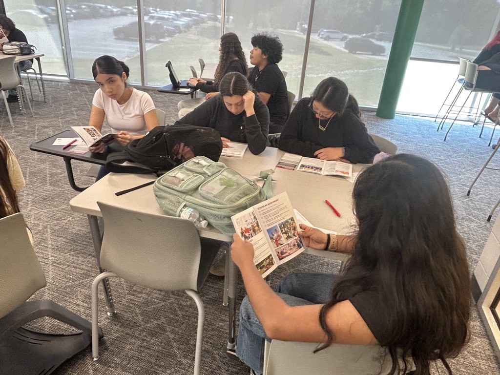 Students looking at materials from U of A
