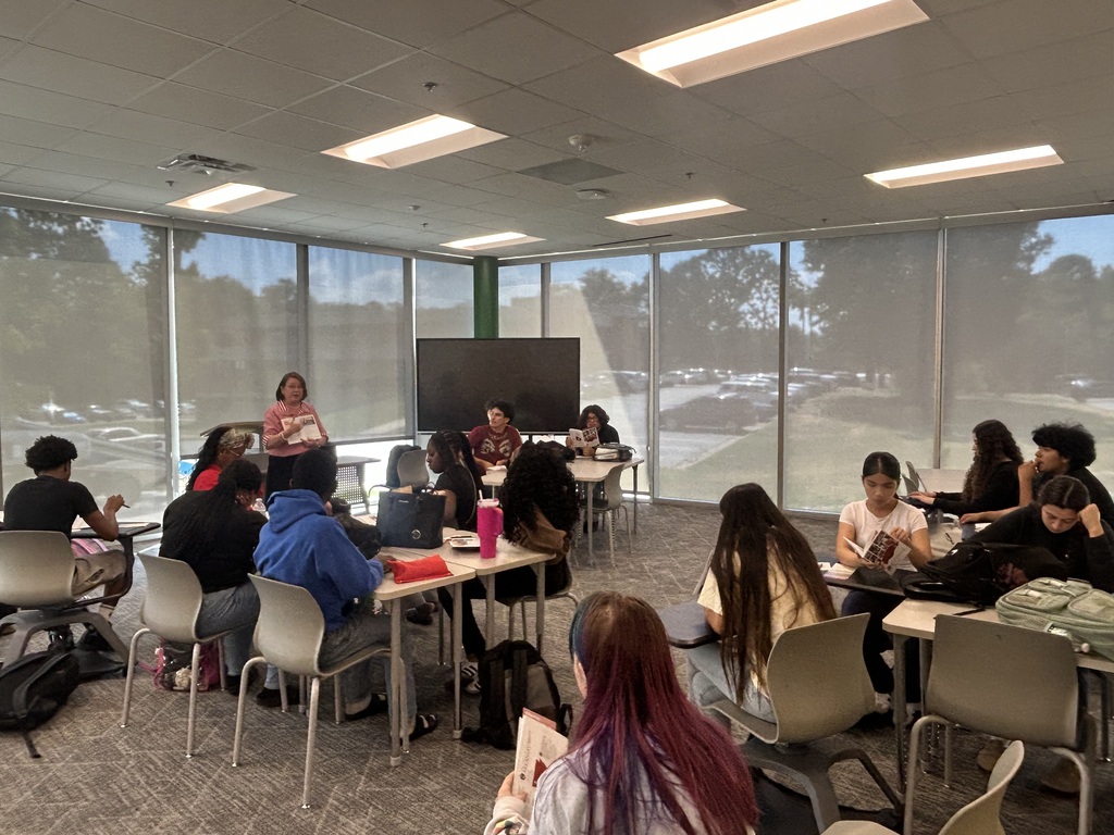 Students in classroom listening to guest speaker