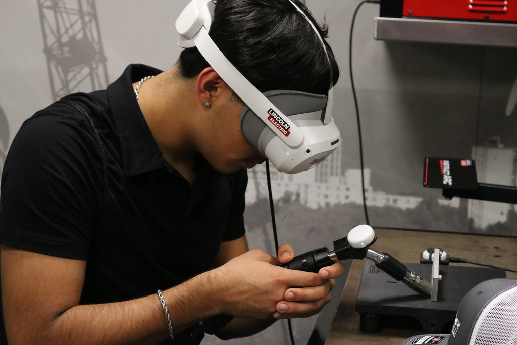 student on welding simulator