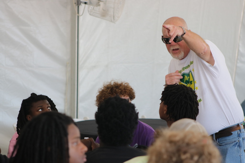 A Mills teacher gives students instruction