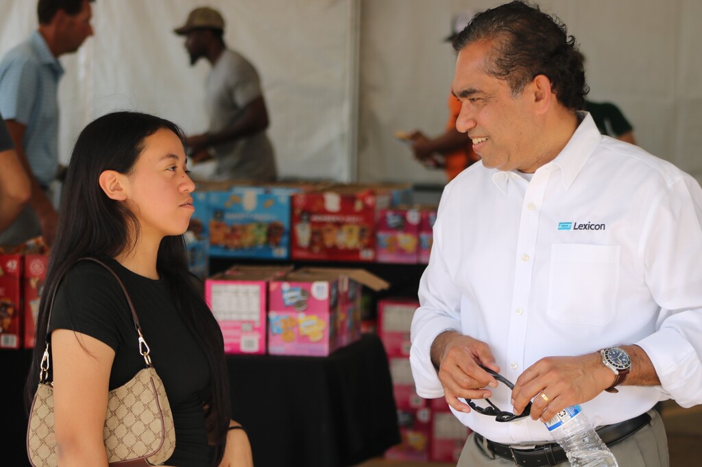 A student speaks with a Lexicon employee