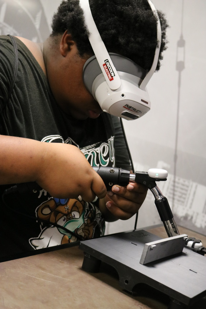 student on welding simulator