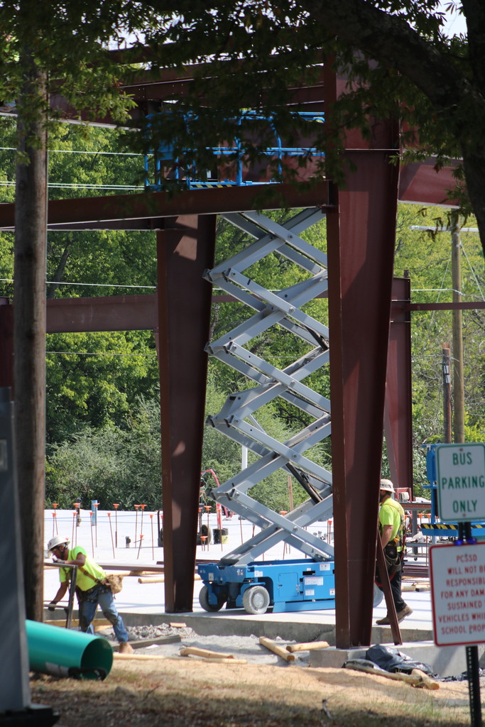 A wide shot of College Station Elementary construction showing a metal frame and scissor lift