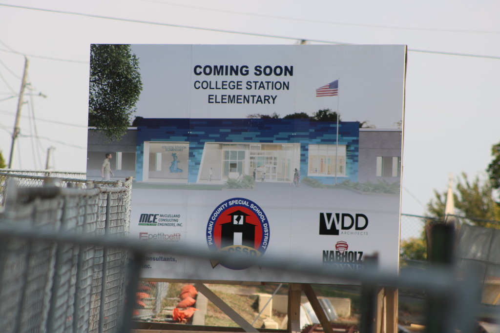 A sign that says Coming Soon College Station Elementary with PCSSD and construction company logos