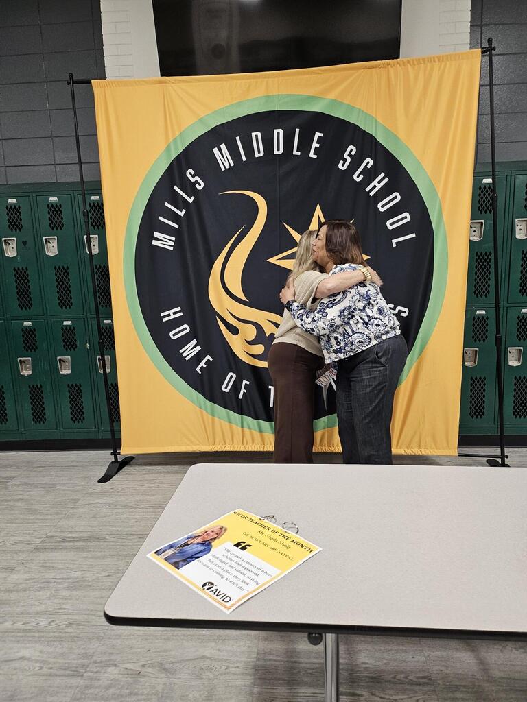 Ms. Shelly congratulated by Dr. Watson for WICOR Teacher of Month