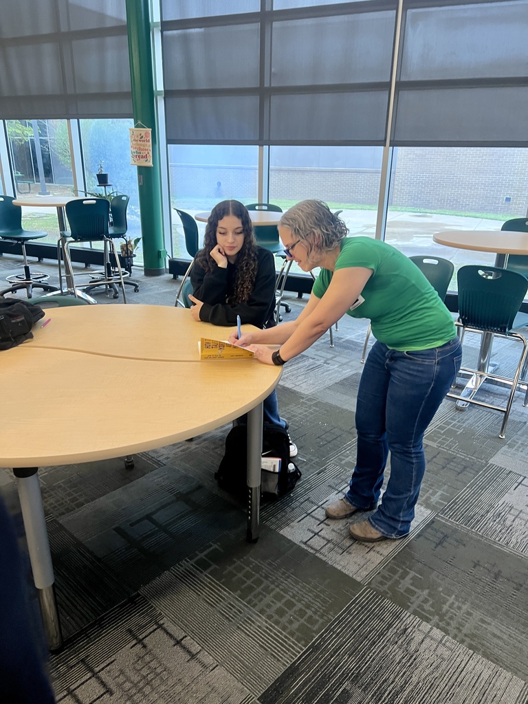 Student getting her book autographed by an author