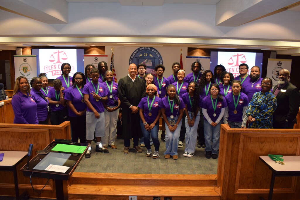 Teen court students smiling for a picture