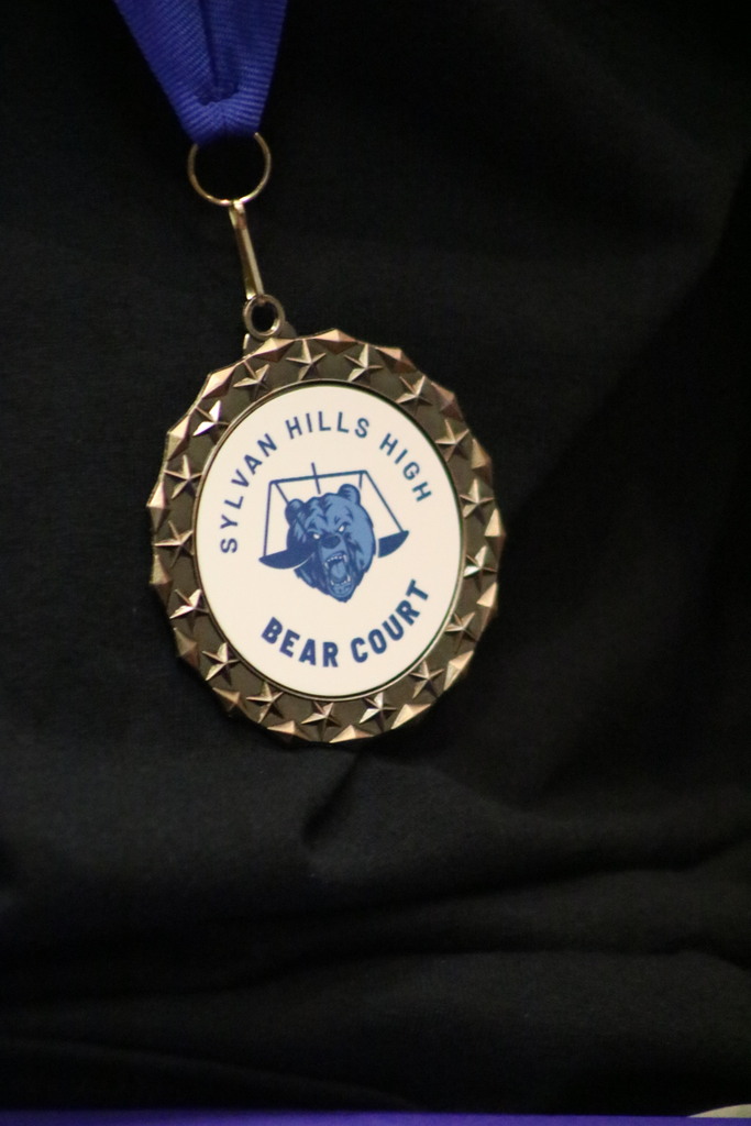 A Sylvan Hills High Bear Court medallion necklace close up
