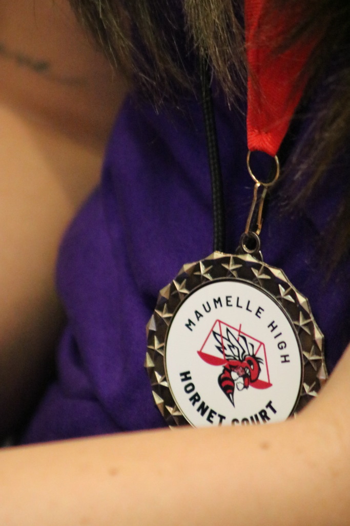 A close up of a Maumelle High Hornet Court medal