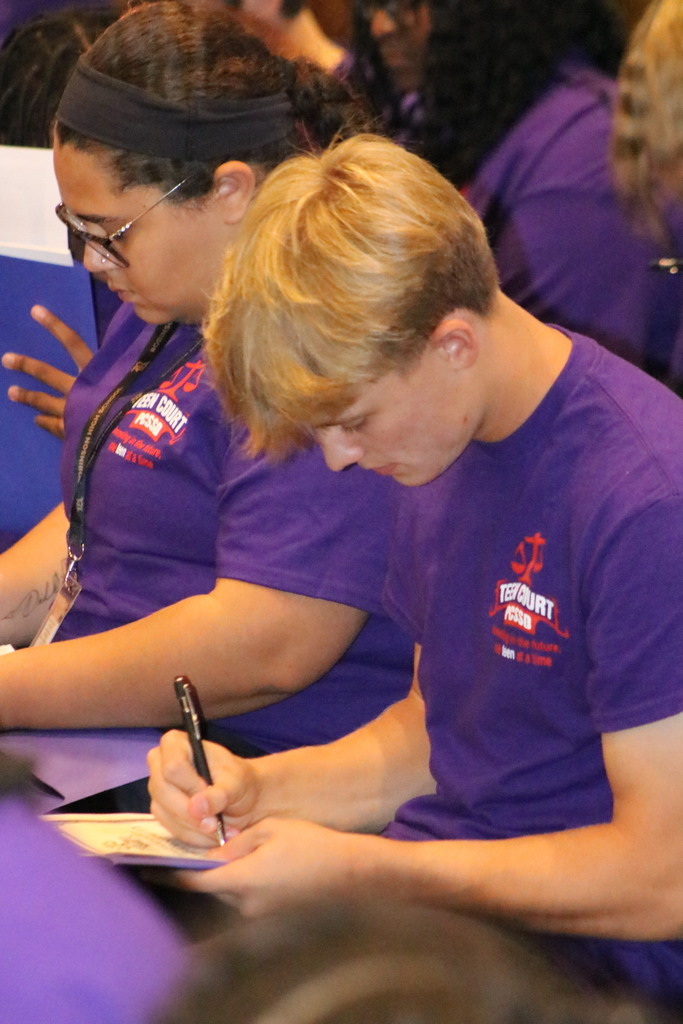 Students signing an oath of confidentiality