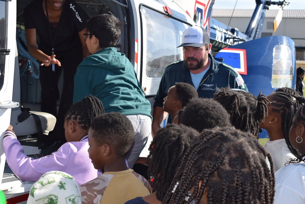 Students board a helicopter for a tour