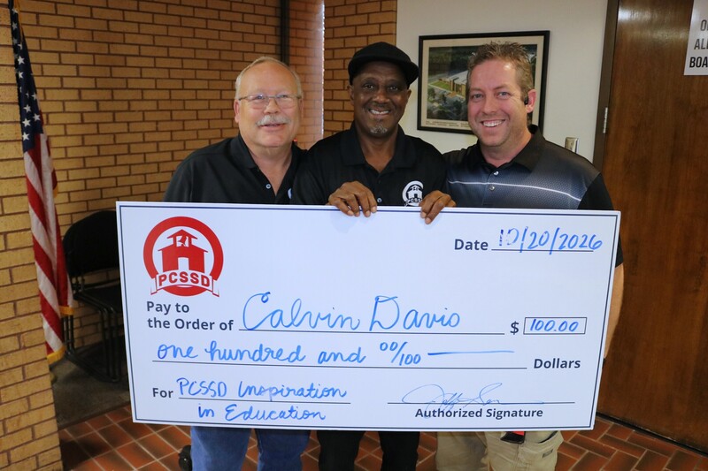 Calvin Davis and his Information Technologies coworkers