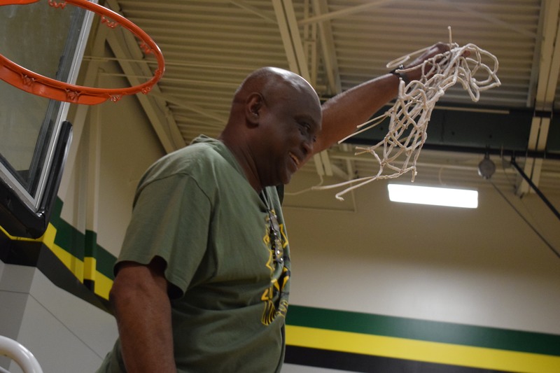 Coach Raymond Cooper lifts cut net