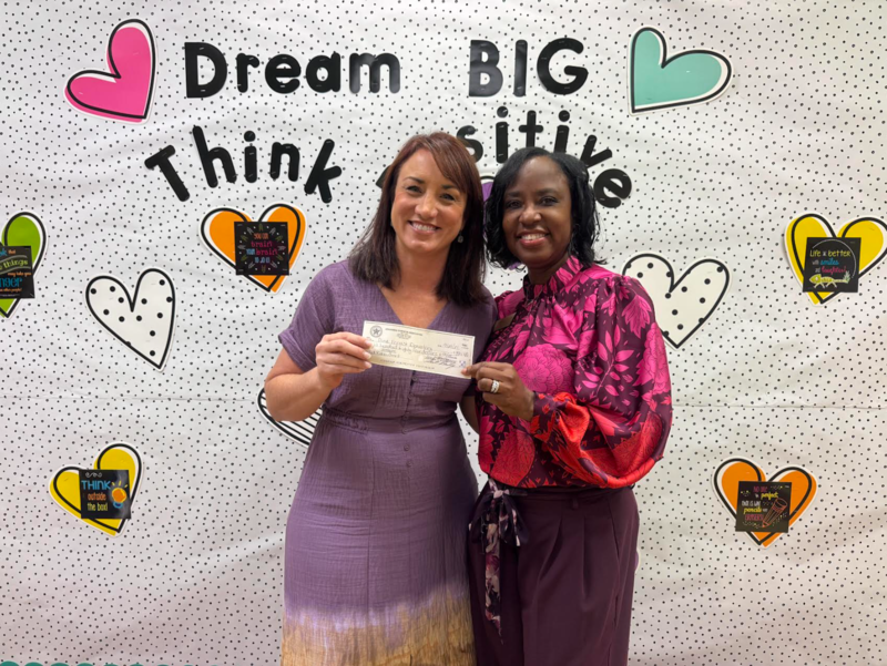 Pine Forest Elementary Counselor Anna Phelps receiving Arkansas Sheriffs’ Association Red Ribbon grant