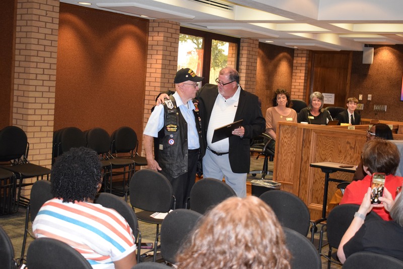 Superintendent Jeff Senn presenting Fuller High School diploma to Vietnam Veteran David Hoss