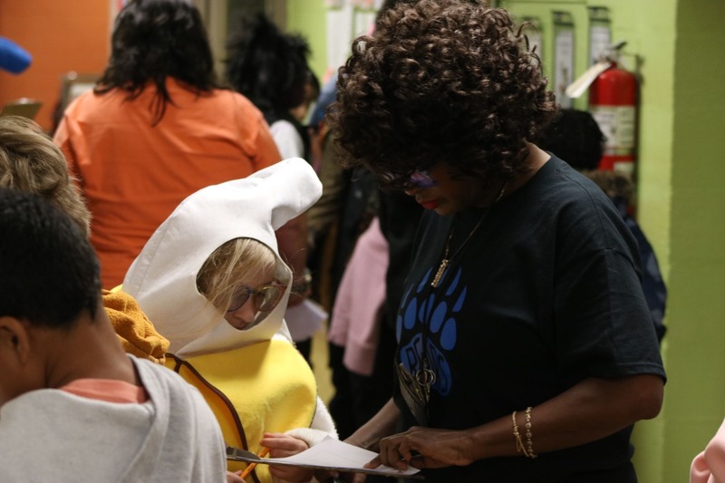 Teacher giving input to a student on their work