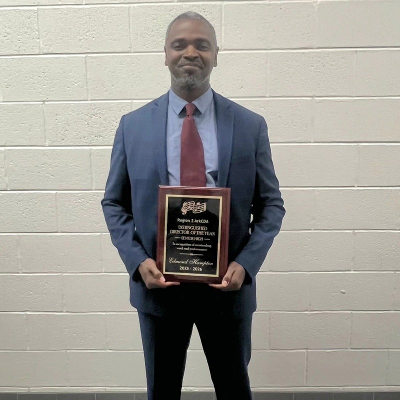 Edmond Hampton holding regional choral director award