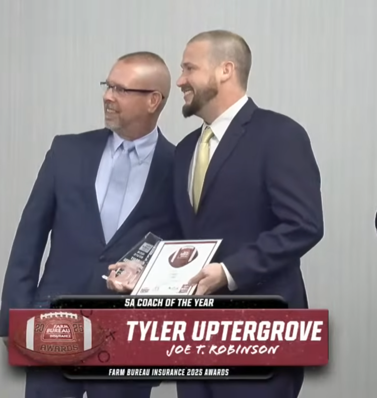 Tyler Uptergrove receiving the 5a coach of the year award