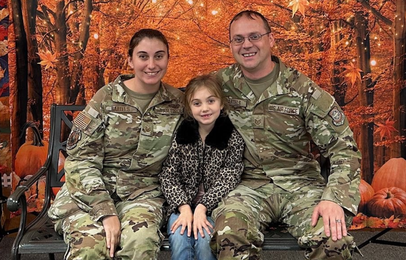 Military family sitting together inside Cato Elementary