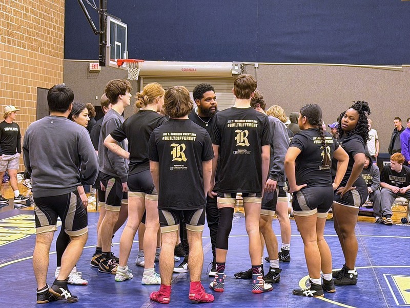 Coach Keilan Patterson talking to his full team