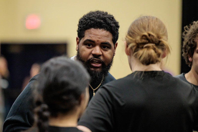 Coach Keilan Patterson in focus with background and foreground out of focus.