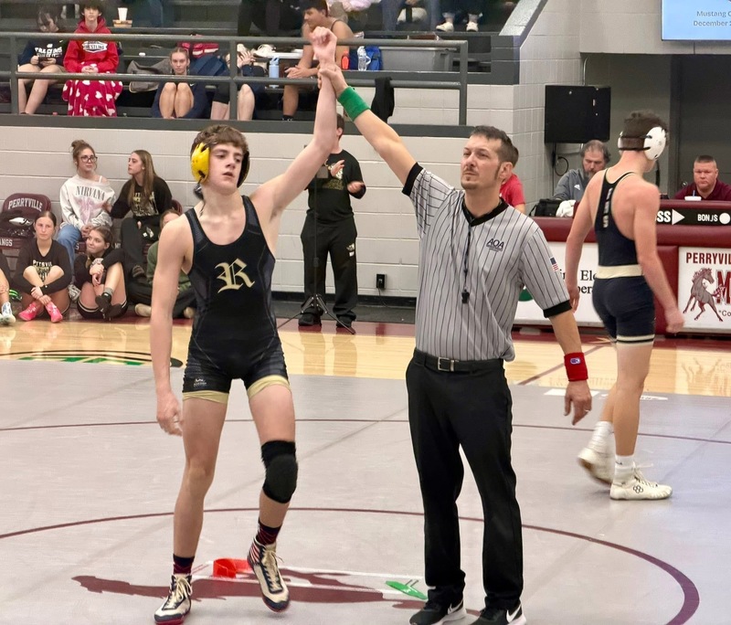 Silas McGaha’s hand held high as the winner of a match