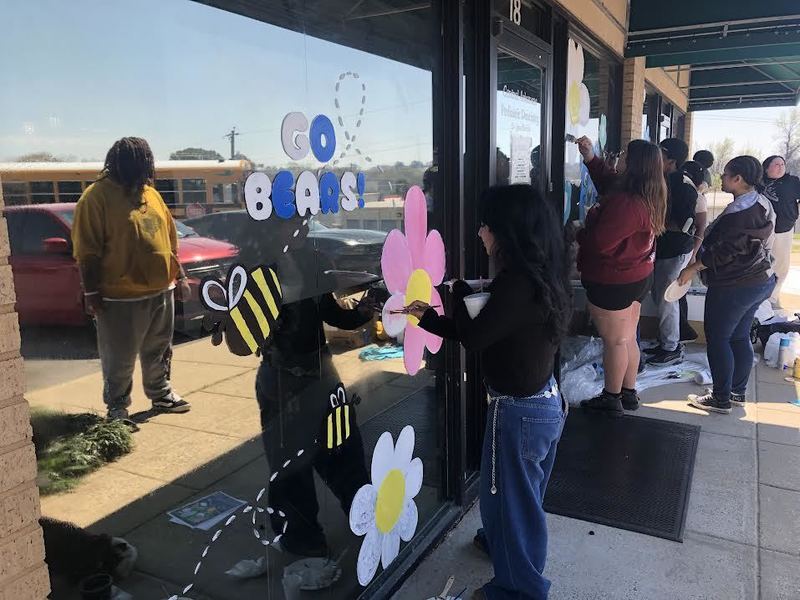 Students painting a mural