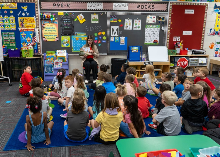 Mattie Carlile sharing her book with Pre-K. 