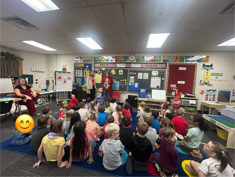 Mattie Carlile sharing her book with Pre-K. 
