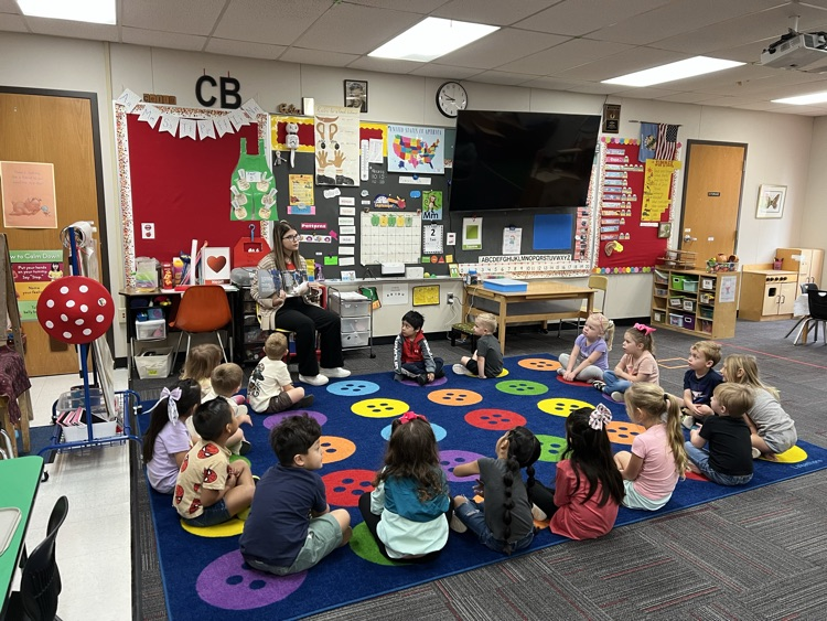 Mattie Carlile sharing her book with Pre-K. 
