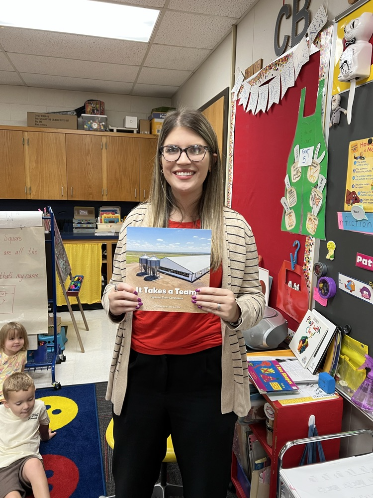 Mattie Carlile sharing her book with Pre-K. 