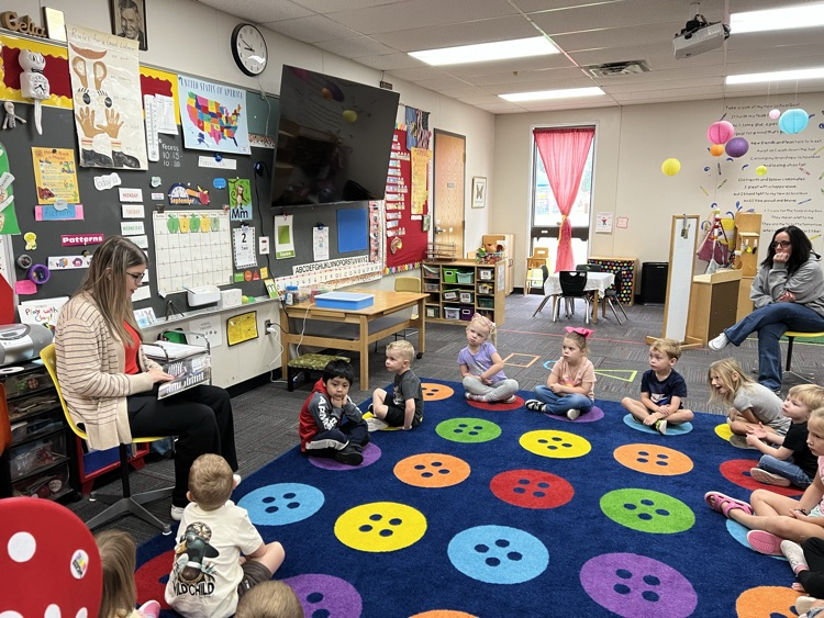 Mattie Carlile sharing her book with Pre-K. 